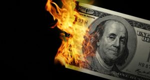 burning 100 dollar bill